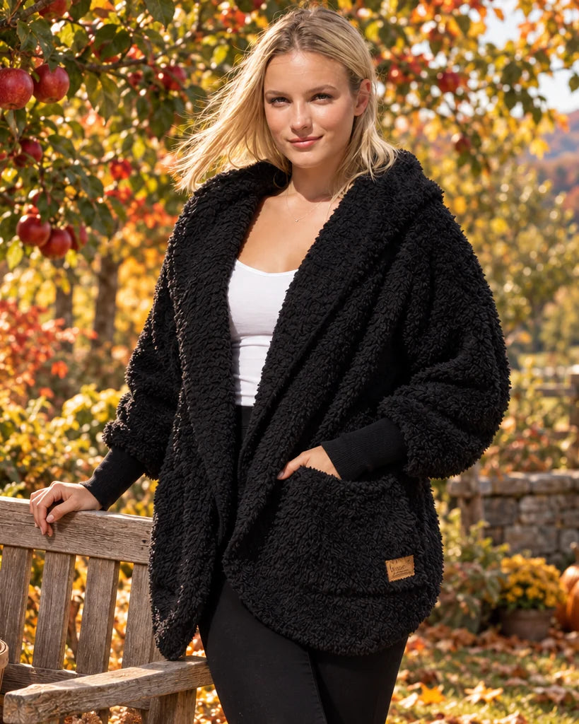 Black Nordic Beach body wrap styled in a colorful autumn orchard
